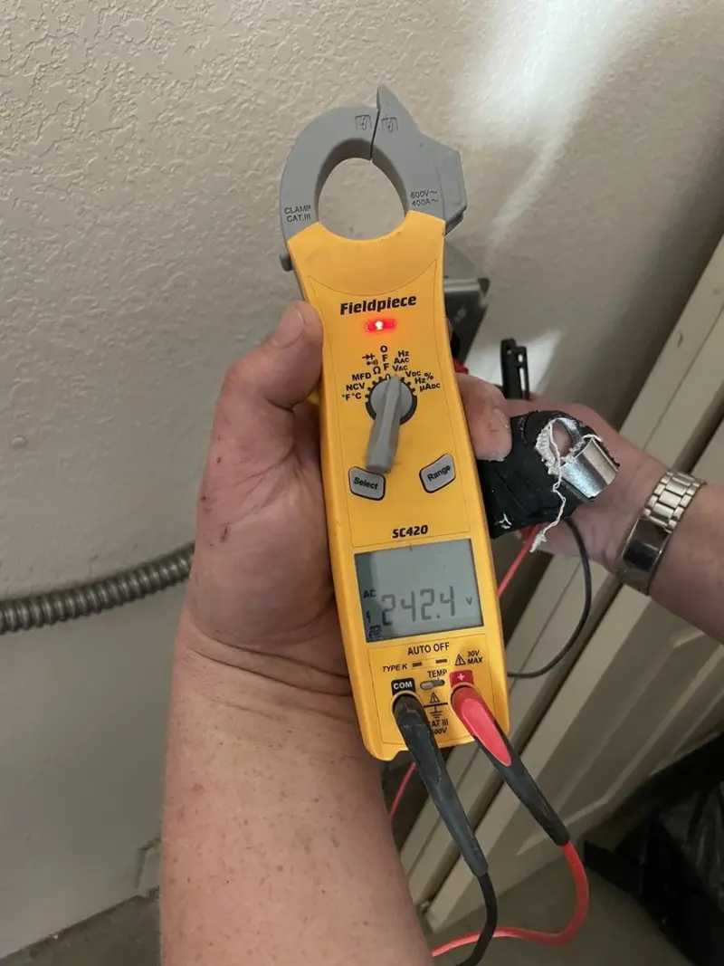 Voltage testing with clamp meter during Outlet Installation in Des Plaines